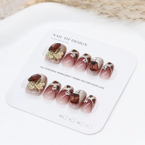 Handmade burgundy cat eye press-on nails with leopard print and 3D bow jewelry