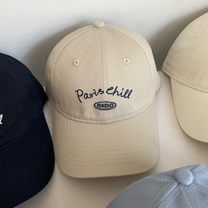 Detail of soft cotton baseball caps featuring Paris Chill RADIO embroidery in multi colors