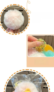 Detail showing plush pink fur keychain with gold ring and soft texture craftsmanship