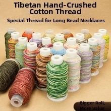Detail view of colorful Tibetan-style hand-rubbed cotton cords for DIY jewelry making.