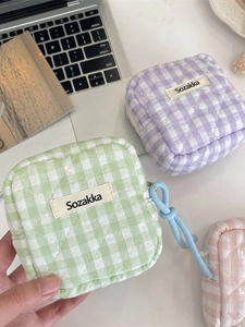Quilted lattice storage pouches in mint green, lilac, and pink with zipper and lanyard