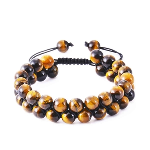 Detailed view of double-row tiger eye stone beads with adjustable black braided cord