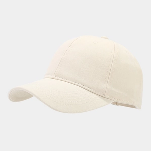 Macro side view of cream cotton twill baseball cap with detailed stitching and texture