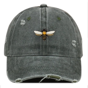 Distressed charcoal gray baseball cap with bee embroidery and vintage washed details