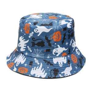 Close-up of Halloween bucket hat with white ghosts, pumpkins and bats on dark blue fabric