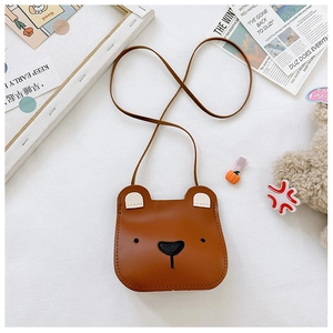 Close-up of brown bear child crossbody bag with cute embroidery and adjustable strap