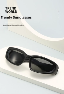 Close-up of black oval Y2K sunglasses on a geometric display stand with dark lenses