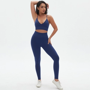 Detail view of seamless dark blue yoga set with V-neck camisole and high waist leggings