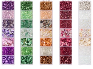 Detailed view of AB colored irregular glass crystal stones in a transparent storage box
