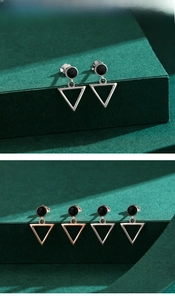 Detail of S925 silver hollow triangle earrings with polished finish and logo engraving