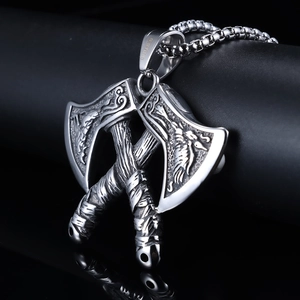 Close-up of stainless steel Viking double axe pendant with intricate engraved details