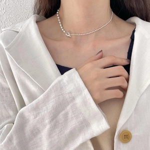 Minimalist 925 sterling silver ball bead necklace with T-bar toggle clasp on model