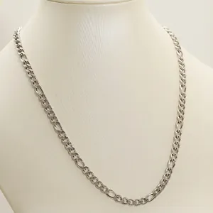 Silver stainless steel Figaro chain necklace for men and women on a beige neck display