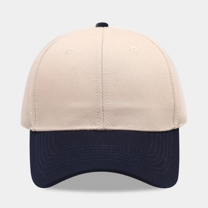 Front view of a two-tone cotton baseball cap with beige panels and navy blue brim
