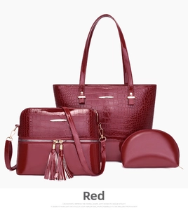 Three-piece burgundy tote set with glossy crocodile texture and tassel crossbody detail
