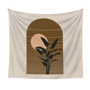 Minimalist Bohemian tapestry featuring black leaves and orange sun on cream fabric