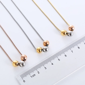 Three-color beaded stainless steel box chains in gold, silver, and rose gold with a ruler