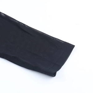 Detail view of the fine black mesh fabric and high-quality stitching on the sleeve cuff