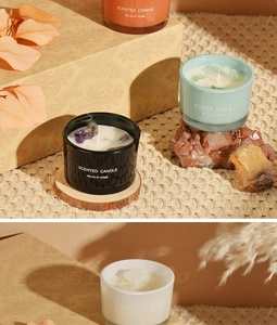 Detailed view of colorful macaron scented candles with crystal stones in glass jars