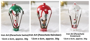 Detail view of 12cm metal Christmas parachutes featuring Santa, elk, and snowman motifs
