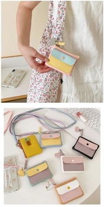Detailed view of colorful PU leather card holders with snap buttons and matching lanyards