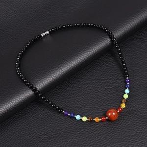 Detail of 6mm healing chakra beaded necklace with vibrant natural stones on black leather