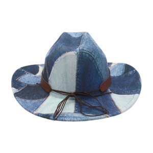 Detail of patchwork denim western hat with brown leather band and intricate stitching