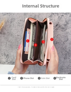 Macro view of pink long wallet interior with card slots, coin pocket and phone section