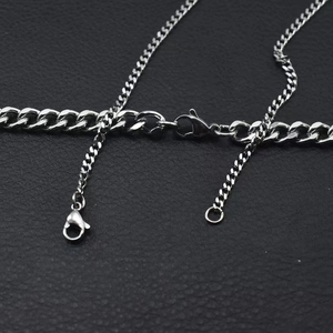 Detailed view of silver titanium steel Cuban link chains with lobster clasp for men