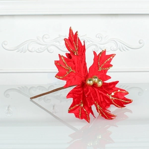 Sparkly red poinsettia Christmas flower with gold sequins and berries for holiday decor