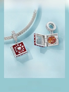 Macro detail of S925 sterling silver pizza charm with hinged opening and enamel detail