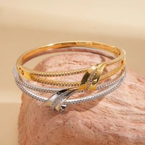 Detail of 18k gold and silver plated double-layer bangles with micro-pave cubic zirconia