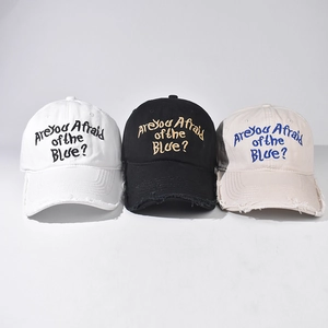 Three-pack washed baseball caps in black white and beige with distressed brim and embroidery
