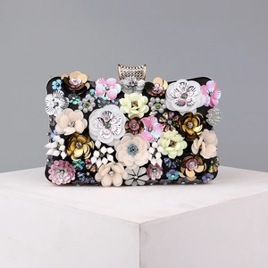 Detail of floral 3D sequins and beads on a black luxury evening clutch bag