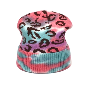 Chic tie-dye leopard print knit beanie in colorful gradient tones for winter warmth