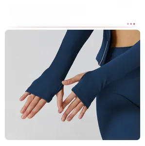 Detail of elongated cuffs with thumbhole design on navy blue slim yoga jacket