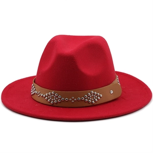 Classic red wool fedora hat with wide brim and studded brown leather decorative band
