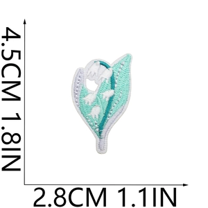 Detail showing lily of the valley floral embroidery dimensions 4.5cm by 2.8cm