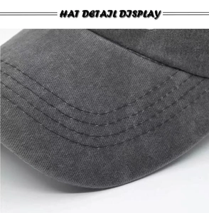 Close-up of high-density stitching on brim and washed fabric of USA baseball cap