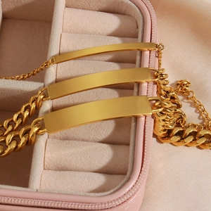 Detailed comparison of three gold Cuban chains with flat plates in a jewelry box