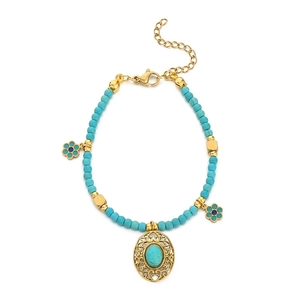 Vintage gold chain bracelet with turquoise beads and hollow oval gemstone pendants