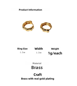 Detailed view of bamboo-shaped gold earrings with 1.2cm size and 1g weight specs