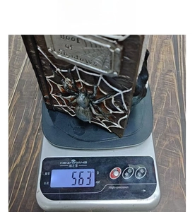 Detailed view of the Book of Shadows resin ghost book model showing weight on a scale