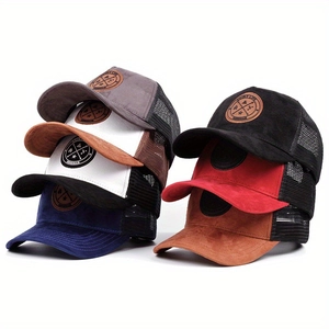 Multiple mesh trucker hats with suede brims and embossed leather patches in various colors