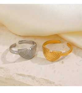 Detailed view of geometric wavy stainless steel open rings in gold and silver finish
