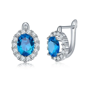 Detailed close-up of oval blue gemstone leverback earrings with zircon halo setting