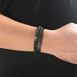 Men's 3-piece bracelet set featuring black volcanic stone beads, cross pendant, and leather
