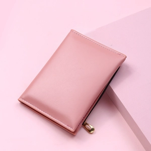 Close-up of pink soft PU leather wallet featuring a stylish gold zipper and multi-card slots