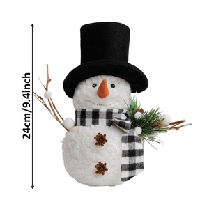 Detail shot of a 24cm plush snowman with black top hat and pine cone accents