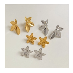 Minimalist leaf and flower earring set in gold and silver finish with polished surface